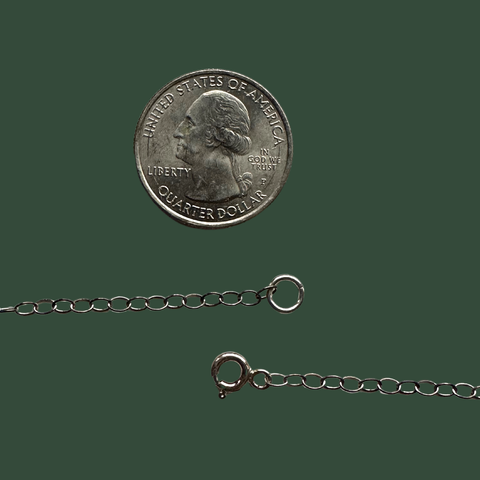 Sterling silver cable chain necklace with spring ring clasp close up with quarter for scale. Handmade female owned artist hand made by holly ulm from Nisswa, MN in Brainerd, Minnesota